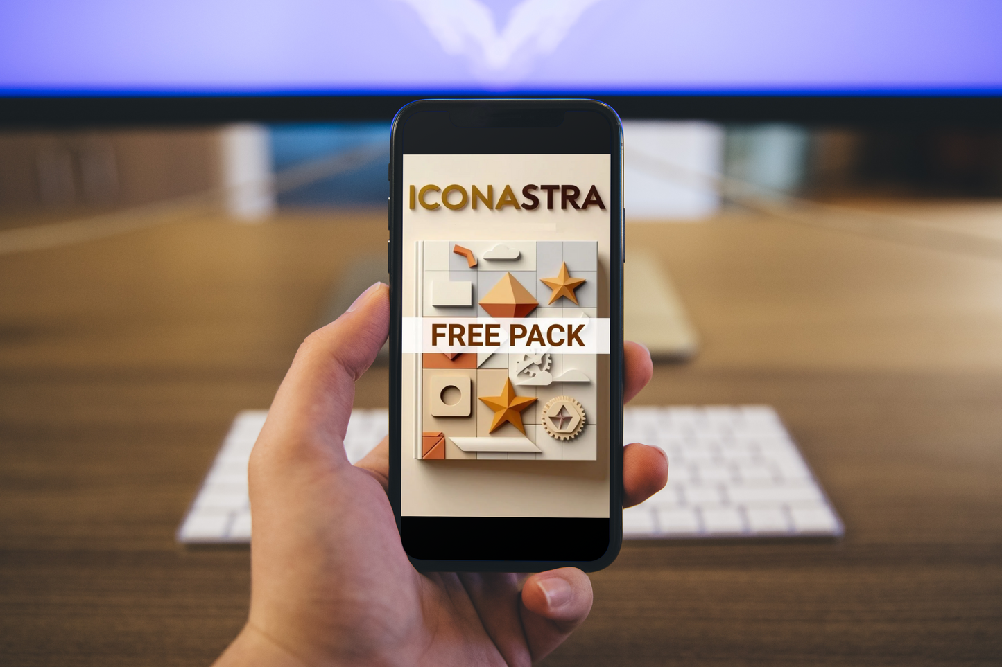 Hand holding a smartphone displaying the Iconastra app with a free pack offer on a blurred office background.