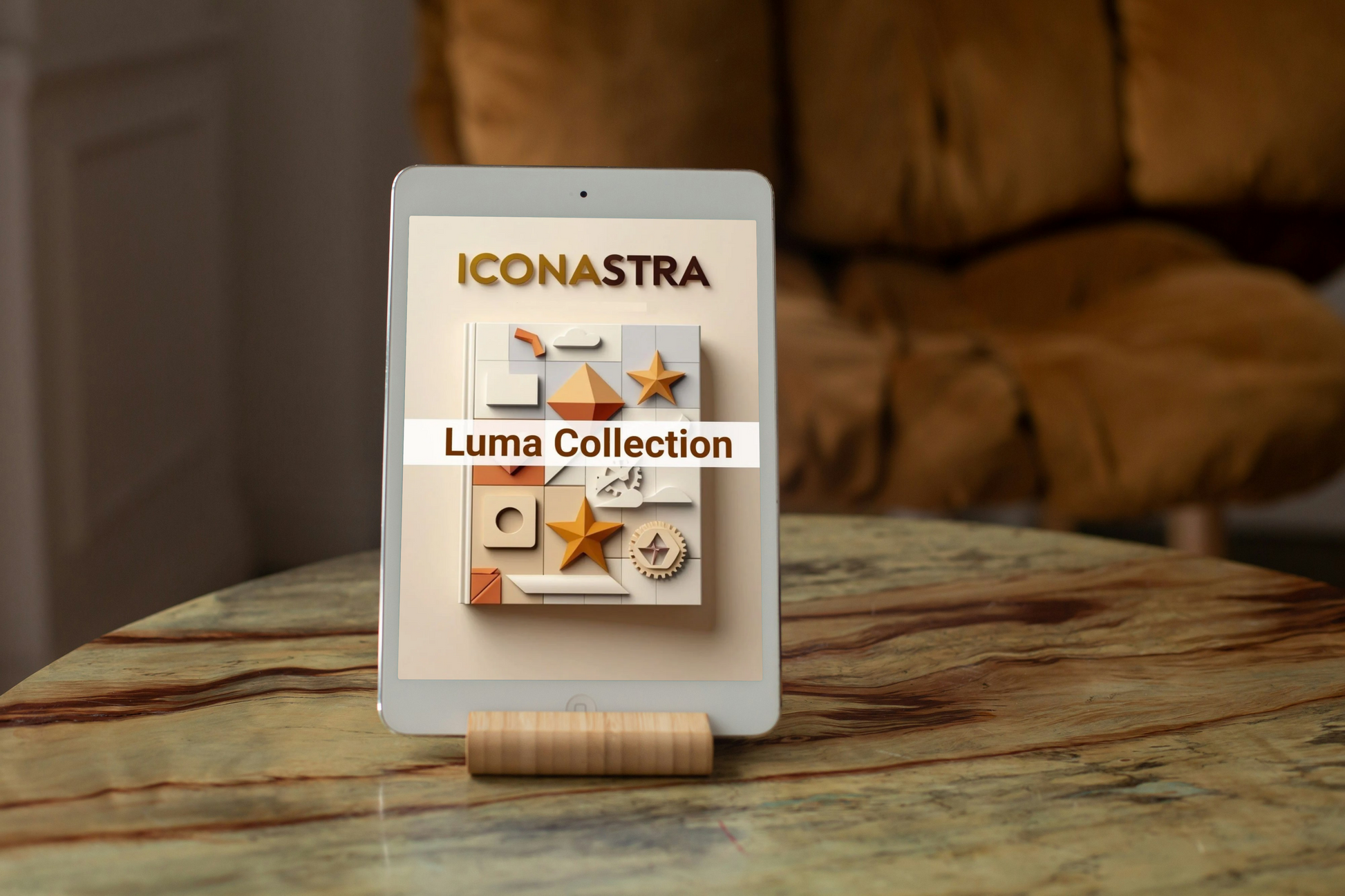 Tablet displaying the Iconastra Luma Collection on a marble surface with a blurred brown background